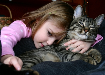 child with cat
